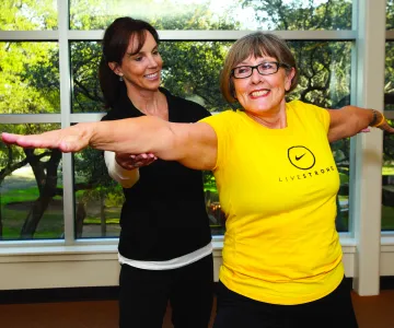 LIVESTRONG participant exercising with certified personal trainer