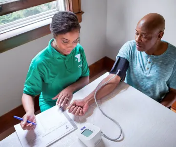 Staff checking a participants blood pressure