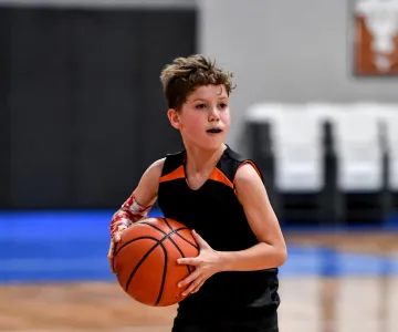 Young boy playing basketball