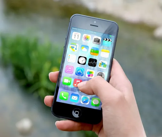 Person holding an iPhone in their hand